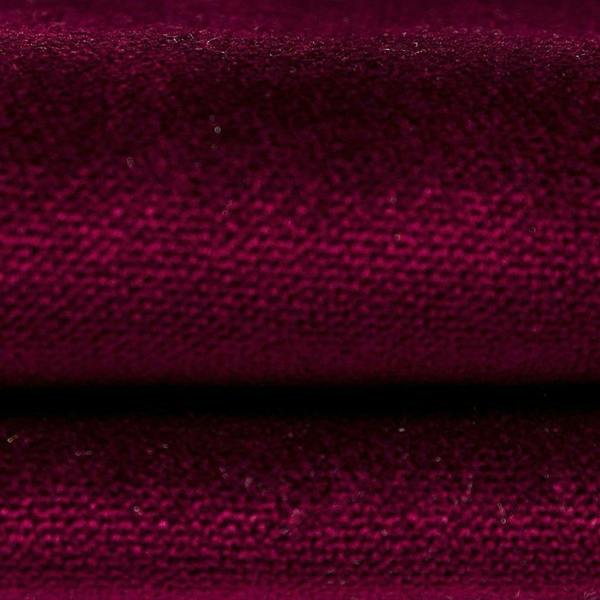 Close-up detail of the plush wine red matt velvet fabric showing the soft velour texture.