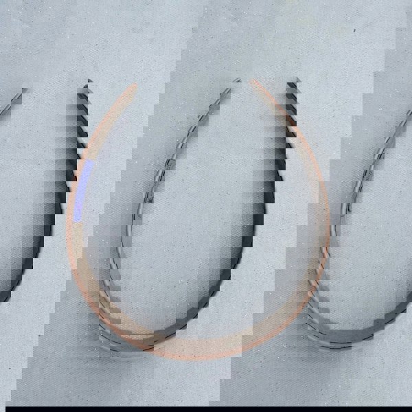 Peach hairband, smooth satin finish, soft pastel tone, plain minimalist design, slim structured style, everyday hair accessory
