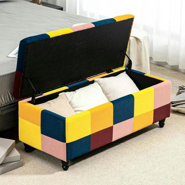 Multicolour patchwork storage ottoman with open lid and white padded interior