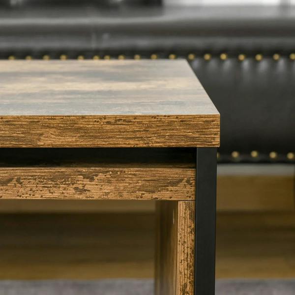 Rustic brown tabletop edge with black metal support frame, close-up detail