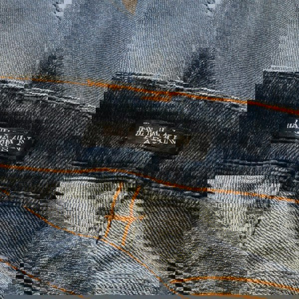 Balmain distressed bootcut jeans in a mid-blue denim
