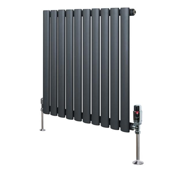 Oval single column radiator in anthracite grey, featuring sleek, rounded tubes and polished valves, ideal for modern interiors
