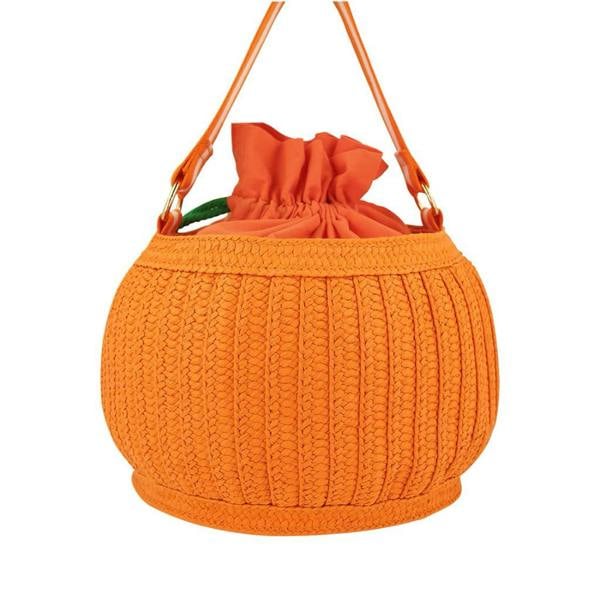 The back view of an orange woven pumpkin trick-or-treat basket bag showing its uniform woven paper texture, fabric drawstring lining, and gold-tone D-rings with a striped handle.