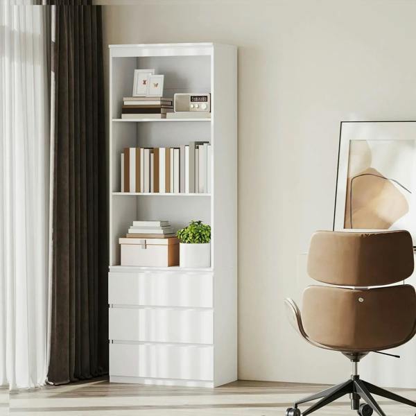 White bookcase with multiple open shelves and drawers, styled with decor.