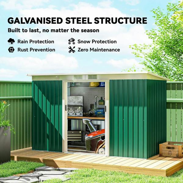 Open deep green metal shed with interior tools and wide double doorway