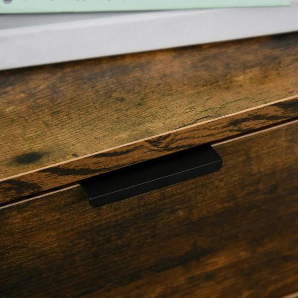 Black bar drawer handle on rustic brown wood-grain dresser front.