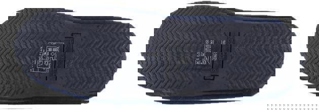 US Polo Assn. US Polo Assn Mens Slip On Loafer Backed Moccasin Style Slippers, a close-up of the sole showing the textured tread pattern and product label.