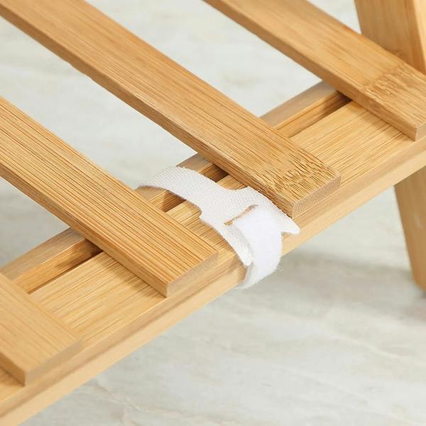 Close-up of bamboo plant stand slatted shelf supports and natural wood finish