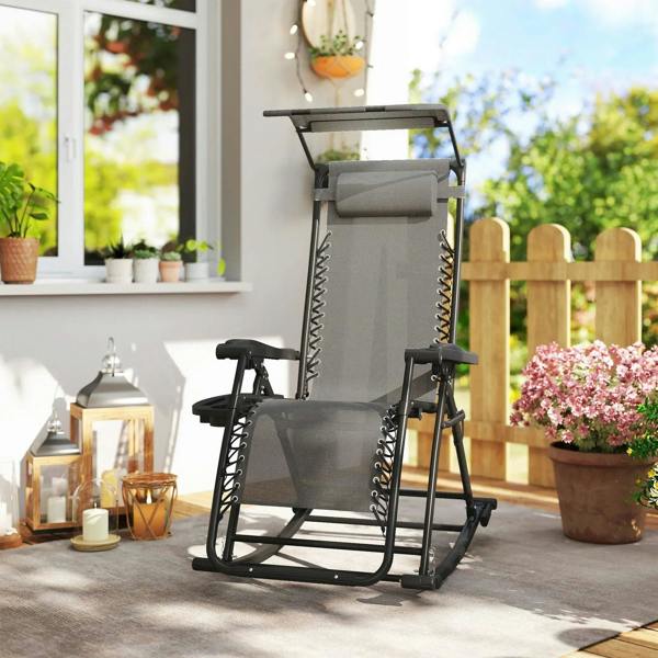 Grey folding rocking recliner chair with headrest and padded seat cushion outdoors