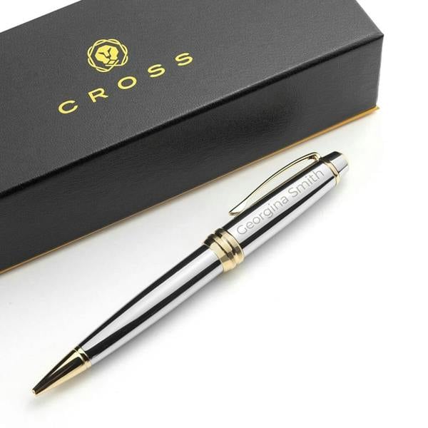 Personalised Cross Medallist pen with gold and silver finish, engraved with the name 'Georgina Smith', resting beside its luxury black branded Cross gift box.
