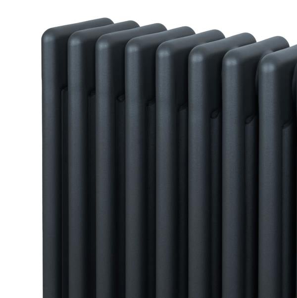 Traditional 4 column radiator in anthracite grey, featuring a sleek, modern design with smooth, textured vertical panels