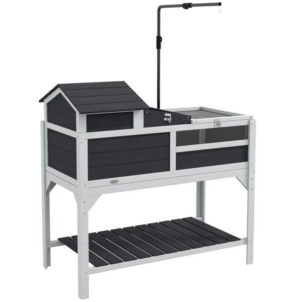 Gray wooden tortoise enclosure with ramp, open top, and adjustable lamp stand