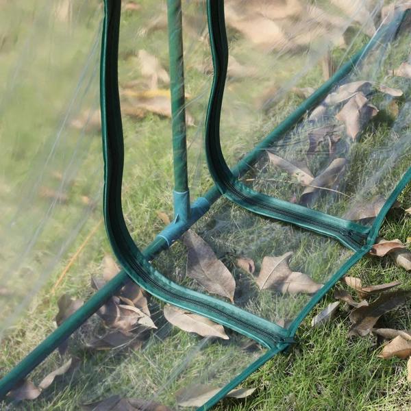 Clear greenhouse door panel with zippered opening and teal steel frame posts