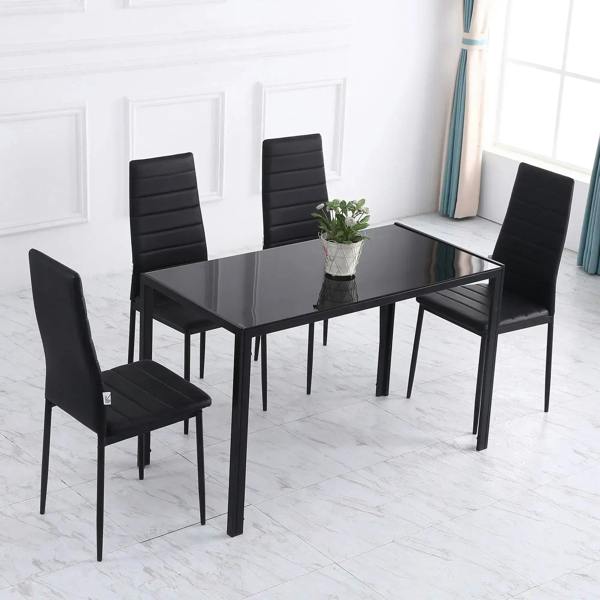 Black dining table with tempered glass top and metal legs, with four chairs