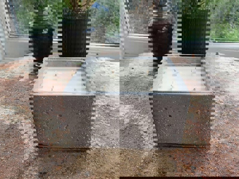 Urban candle in concrete square