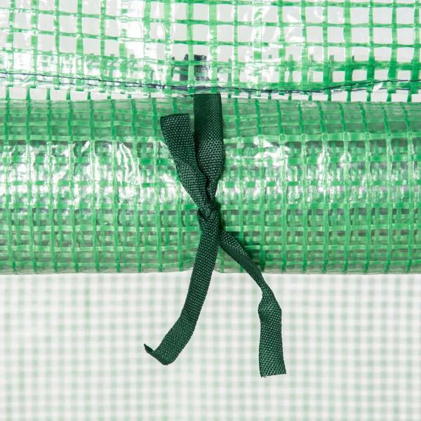 Close-up of green zippered door cord on a PE-covered mini greenhouse entrance
