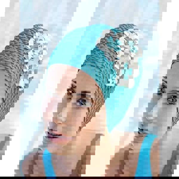 Turquoise textured Fashy Flower Bubble Swim Cap with white floral details