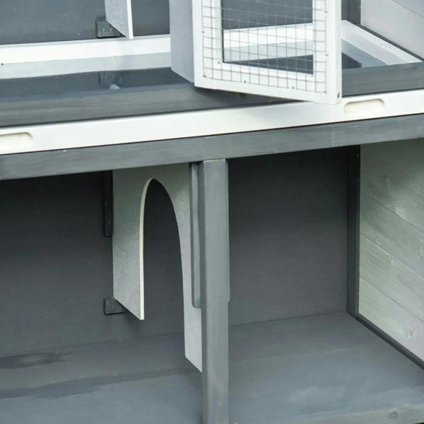 Interior view of grey 2-tier rabbit hutch showing arched openings under the upper level
