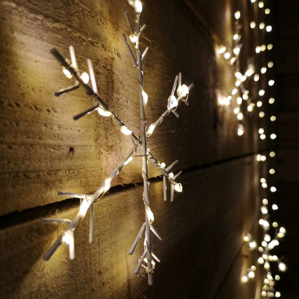 Samuel Alexander 1.2m x 1.2m Christmas Static Snowflake LED Silver Pin Wire V Curtain Lights in Warm White