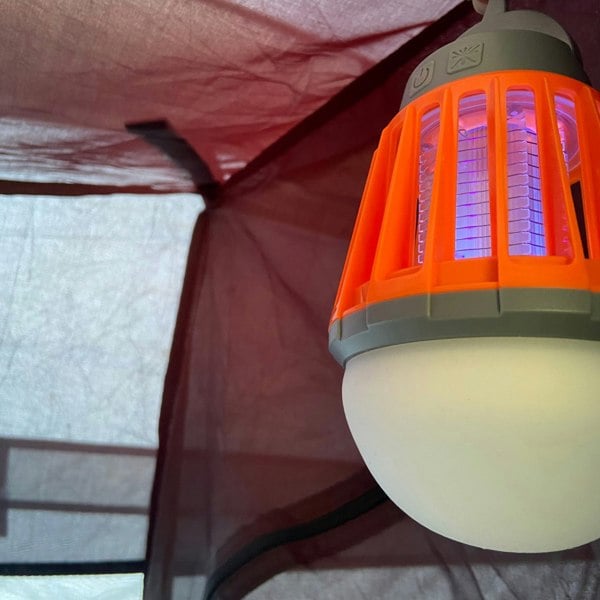 Close-up image of OLPRO Mosquito Killer Lantern on a white background, hung inside a tent/awning.