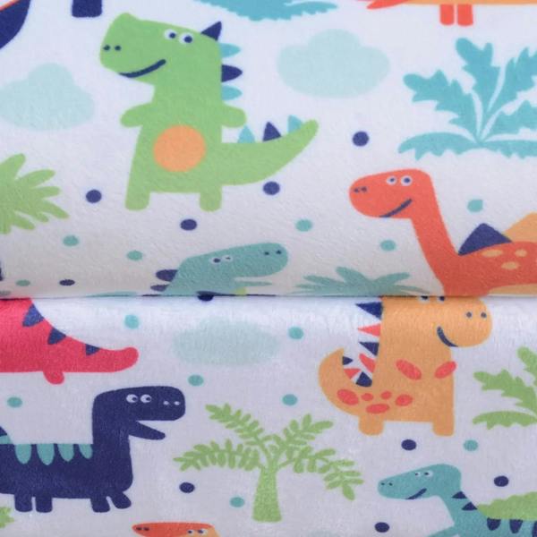 Close-up of dinosaur pattern upholstery on a kids flannel tub chair seat