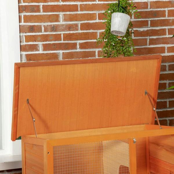 Two-tier wooden rabbit hutch with raised lid and wire mesh front door panels
