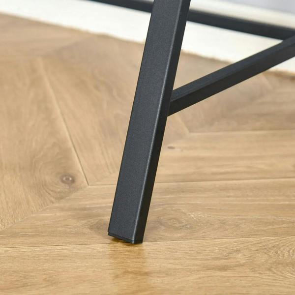 Black metal desk leg for a walnut two-tier table.