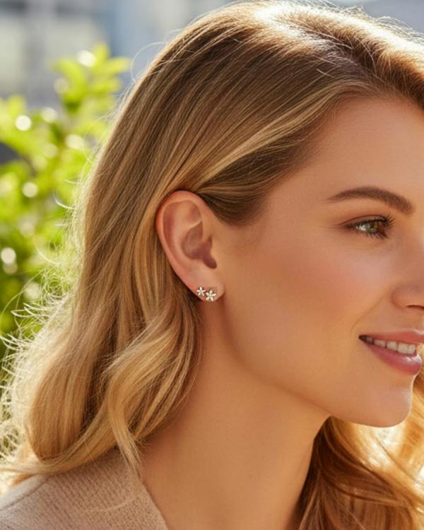 Woman with styled hair and earrings outdoors. bloomtine_eternal_bloom_flower_studs_gold_silver_the_perfect_gift