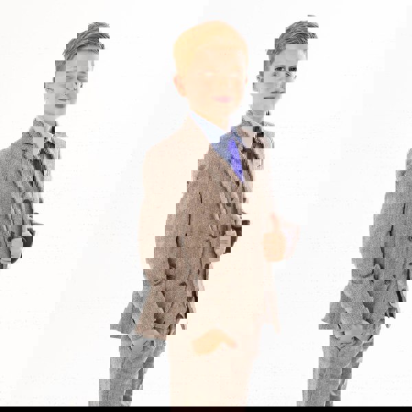 Boy wearing brown herringbone suit for UK Flower Girl Boutique