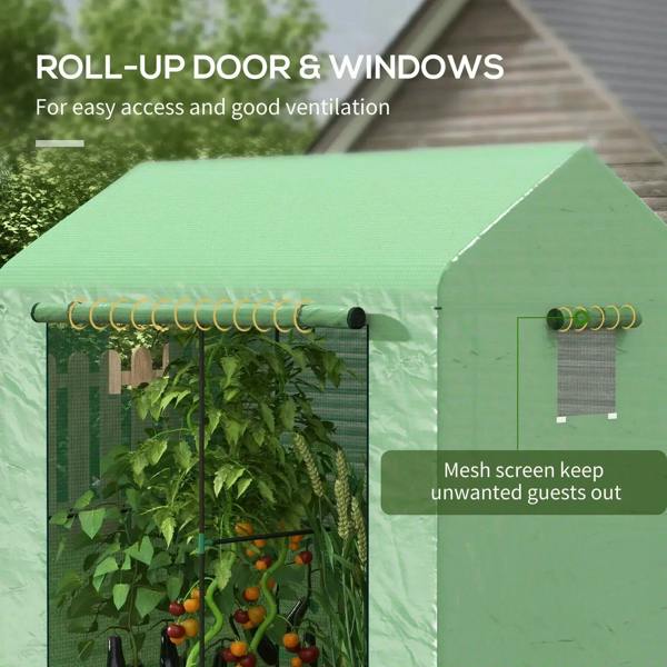 Green walk-in greenhouse with roll-up mesh door and side window panels, plants inside