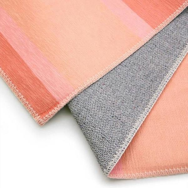 Two fabric samples, one pink and one gray, on a white background.