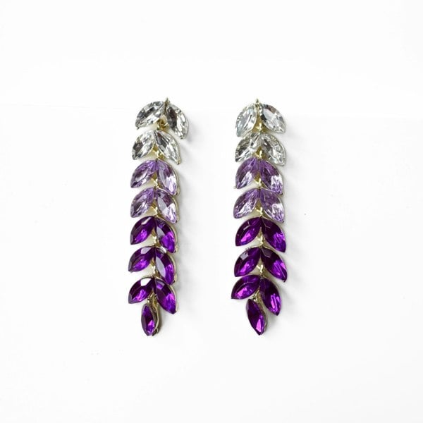Purple and clear crystal earrings on a white background