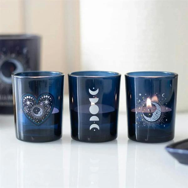 Set of 3 blue votive candle holders with moon, heart, and star designs