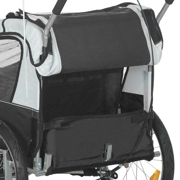 Black fabric rear panel of a 2-seat bike trailer with straps and harness attachment points