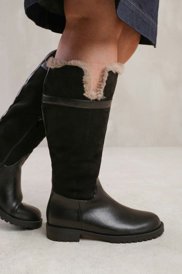 Where's That From Kendra Wide Calf Knee High Boots With Fur Trim and Lining in Wide E Fit in Black Suede and Faux Leather