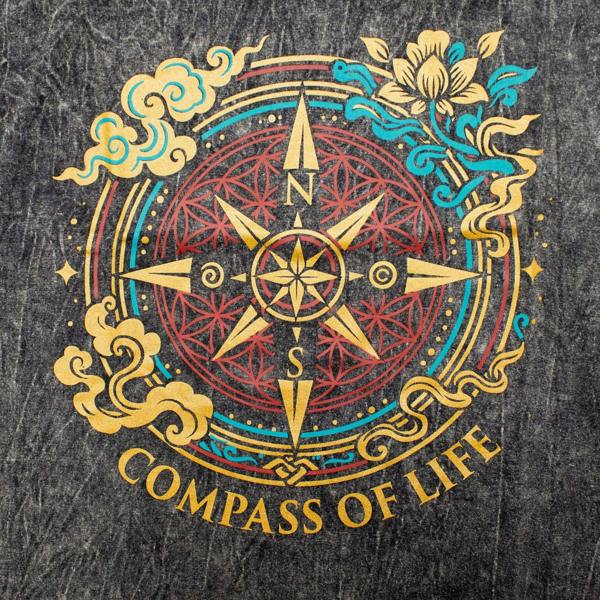 Close-up of Compass of Life graphic on charcoal stonewashed cotton T-shirt