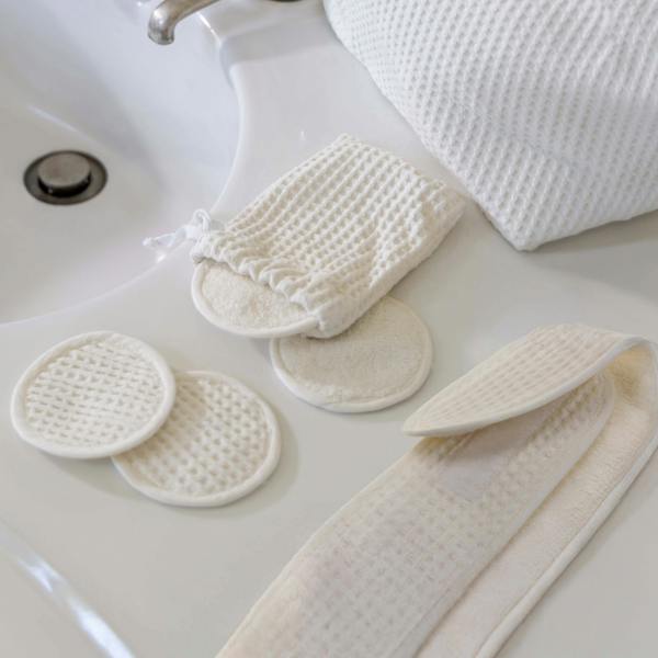 Ecru Waffle Cotton Re-Usable Face Pads & Headband Set in a styled bedroom | Soak and Sleep