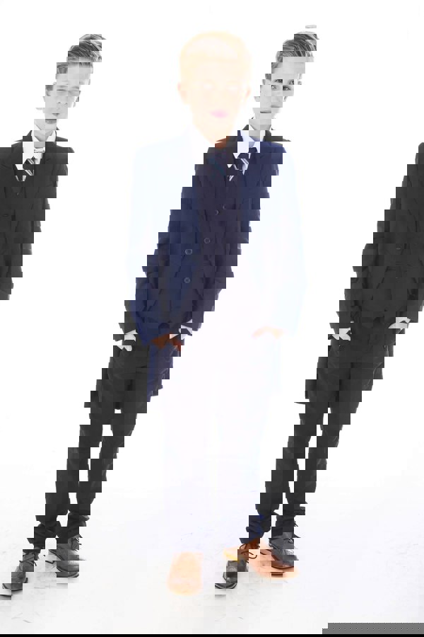 Boy wearing navy tail coat