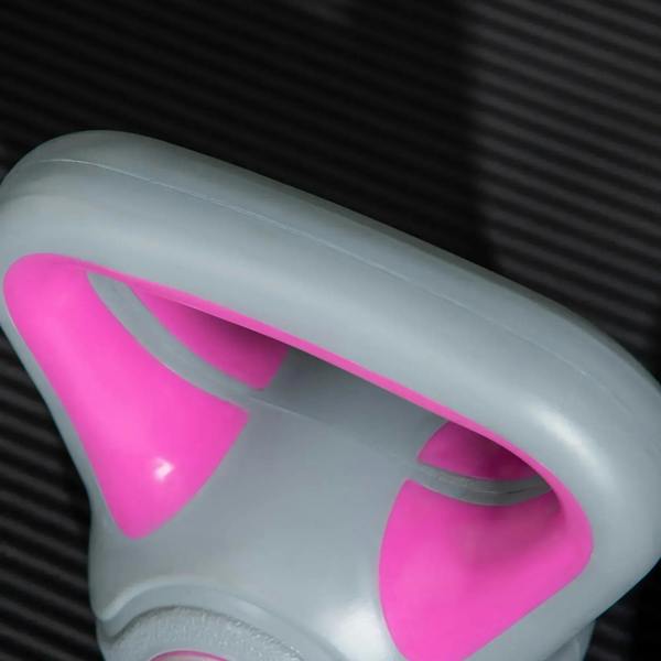 Close-up of pink-handle and grey-body kettlebell with glossy finish