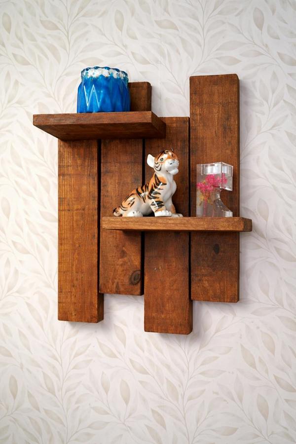 Antique pine staggered wooden wall shelf mounted on wall