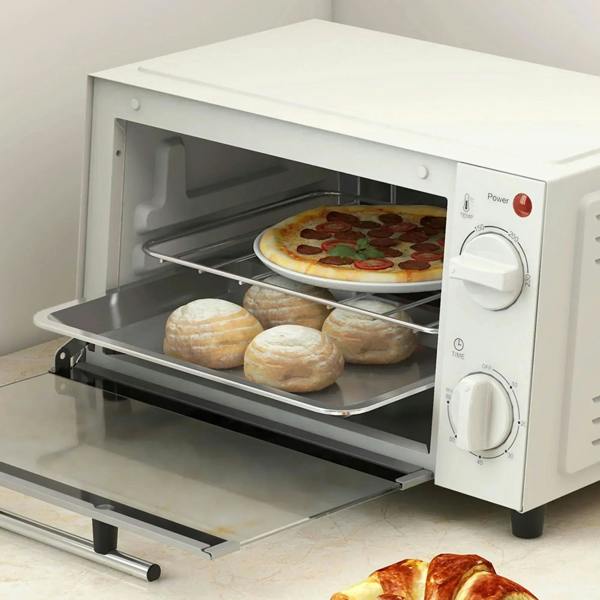 Cream mini oven with pizza and bread rolls on wire rack, door open
