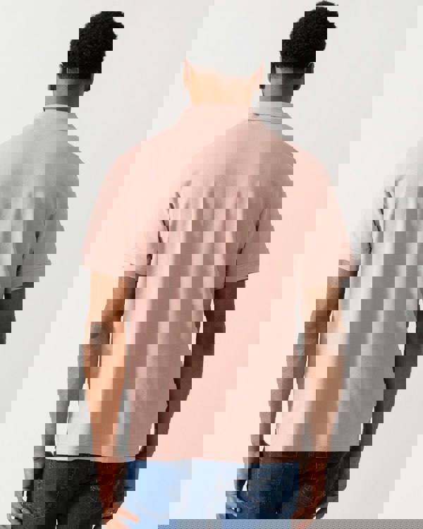 back shot of a Model wearing a Belstaff Short Sleeved Mens Polo in Dusk Pink