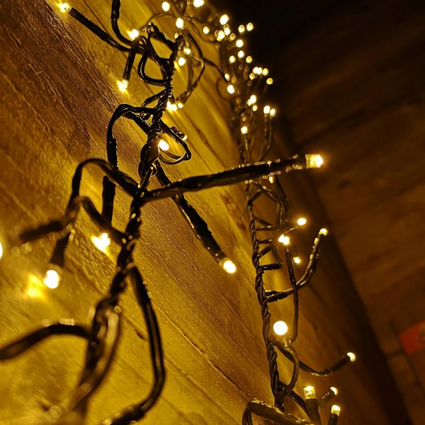 Samuel Alexander 960 LED 12m Premier Cluster Indoor Outdoor Multi Function Mains Operated Christmas Lights with Timer on Clear Cable in Warm White