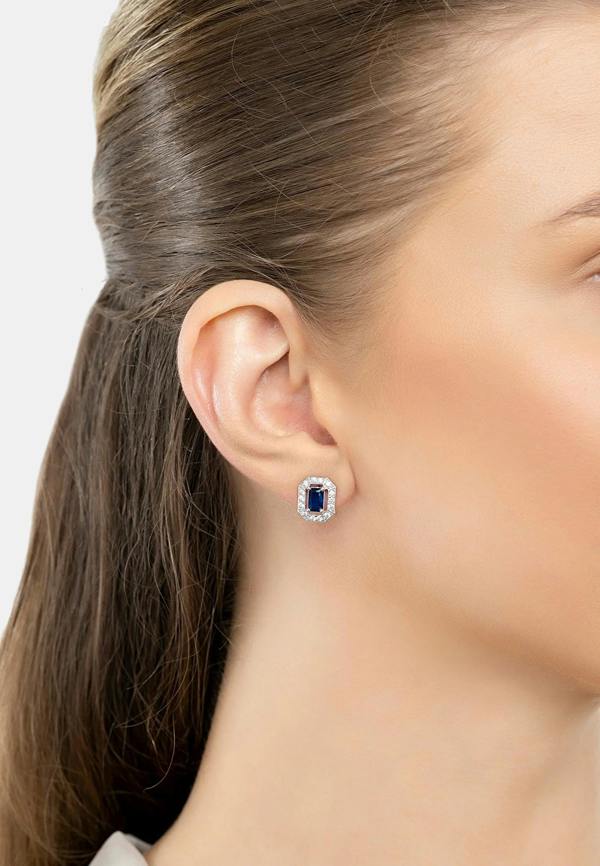 The earring worn by a model.