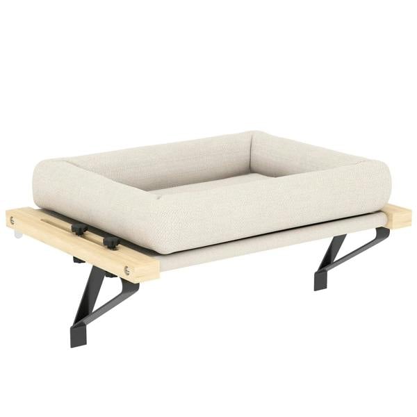 Cream cat radiator bed with cushioned insert on wooden platform and black metal legs