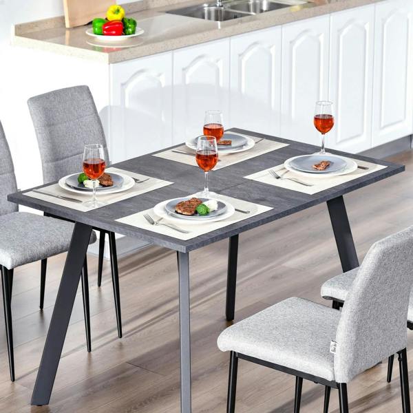 Charcoal grey rectangular dining table with metal legs and stone-like textured top