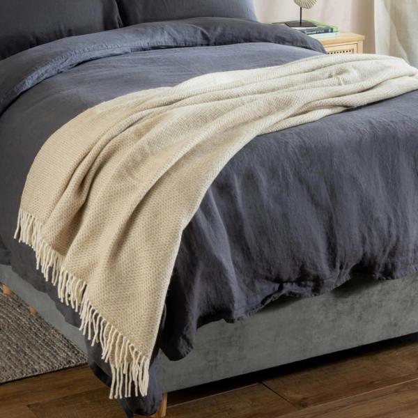 Oatmeal Honeycomb Pure Wool Throw - Temperature regulating, styled in a bedroom | Soak and Sleep