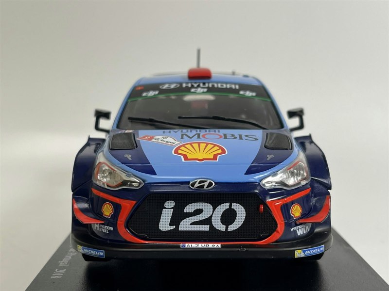 a blue race car with red and blue stripes