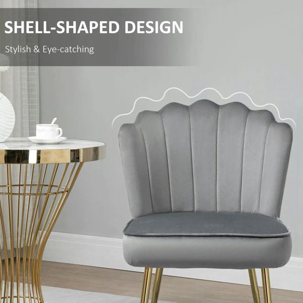 Grey shell-shaped accent chair with vertical channel tufting and cushioned seat
