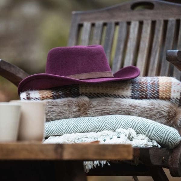 Hoggs of Fife Perth Crushable felt hat in Merlot on blankets outside on decking
